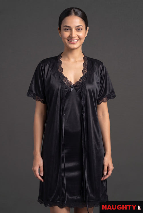 Naughty black silky satin 2-piece lingerie set with lace-trimmed nightdress and matching robe on a smiling model